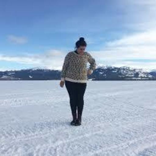 Caleigh Alleyne, Social Media Manager at Works Design, standing in the snow.