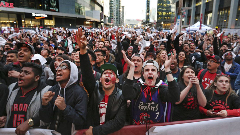 Raptors fans gathered to cheer on their team in Jurassic Park beside the ACC.