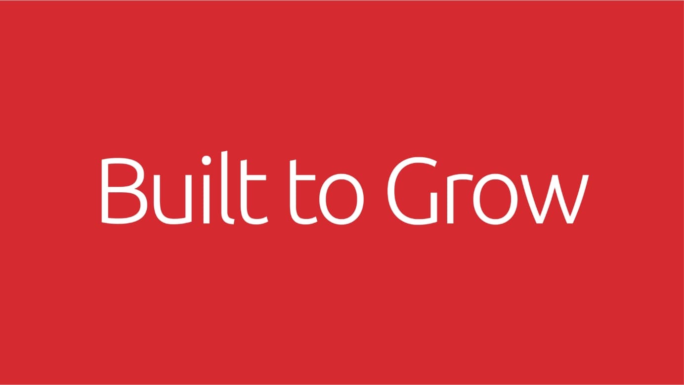 White text on a red background with the words “Built to Grow”.