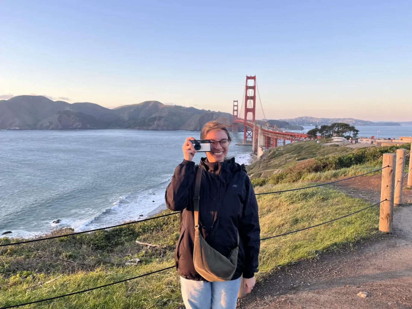 Photo of Thaisa taking a picture of the person taking a picture of them.